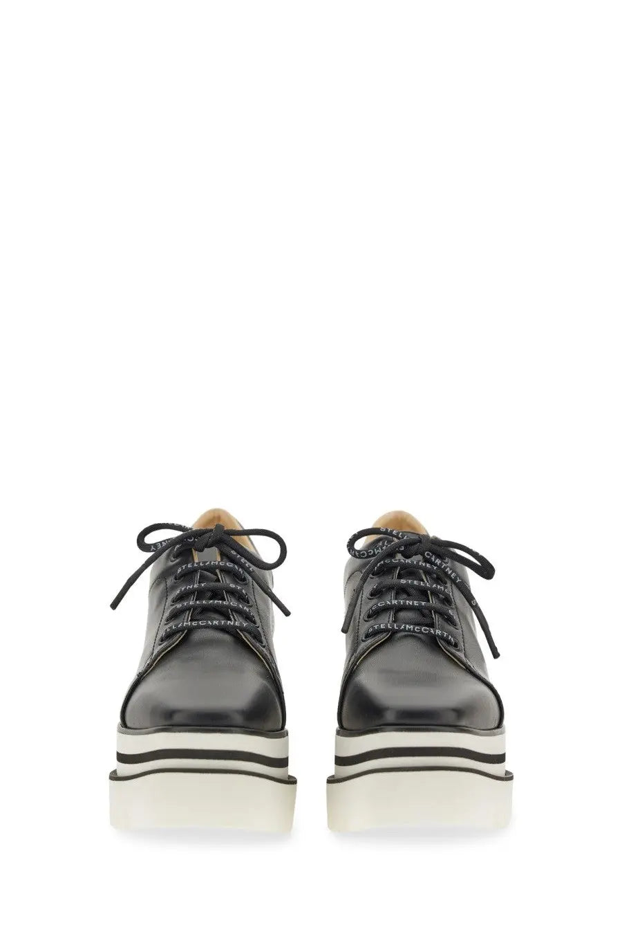 Stella McCartney women’s black leather platform sneakers with white black striped soles and branded laces