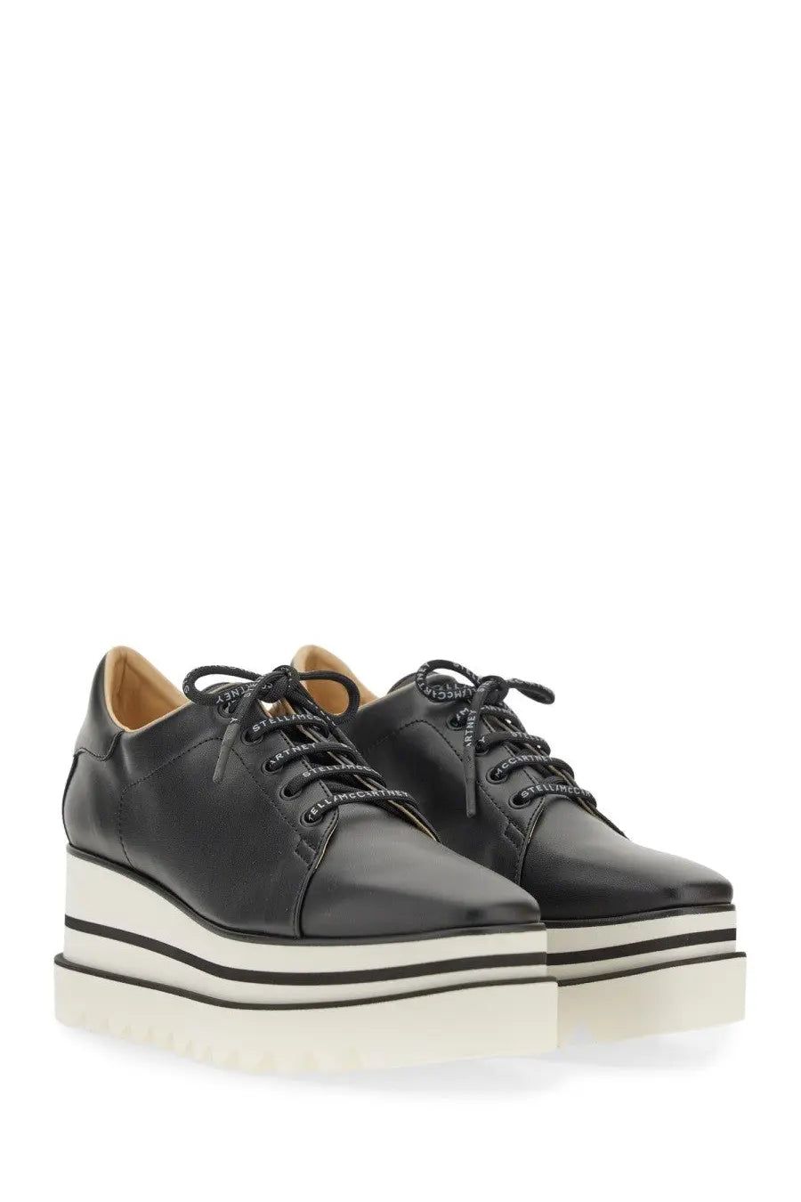 Stella McCartney women’s black leather platform sneakers with white and black striped sole
