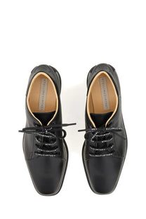 Black leather lace-up oxford shoes with white stella mccartney branding on laces and insole for women