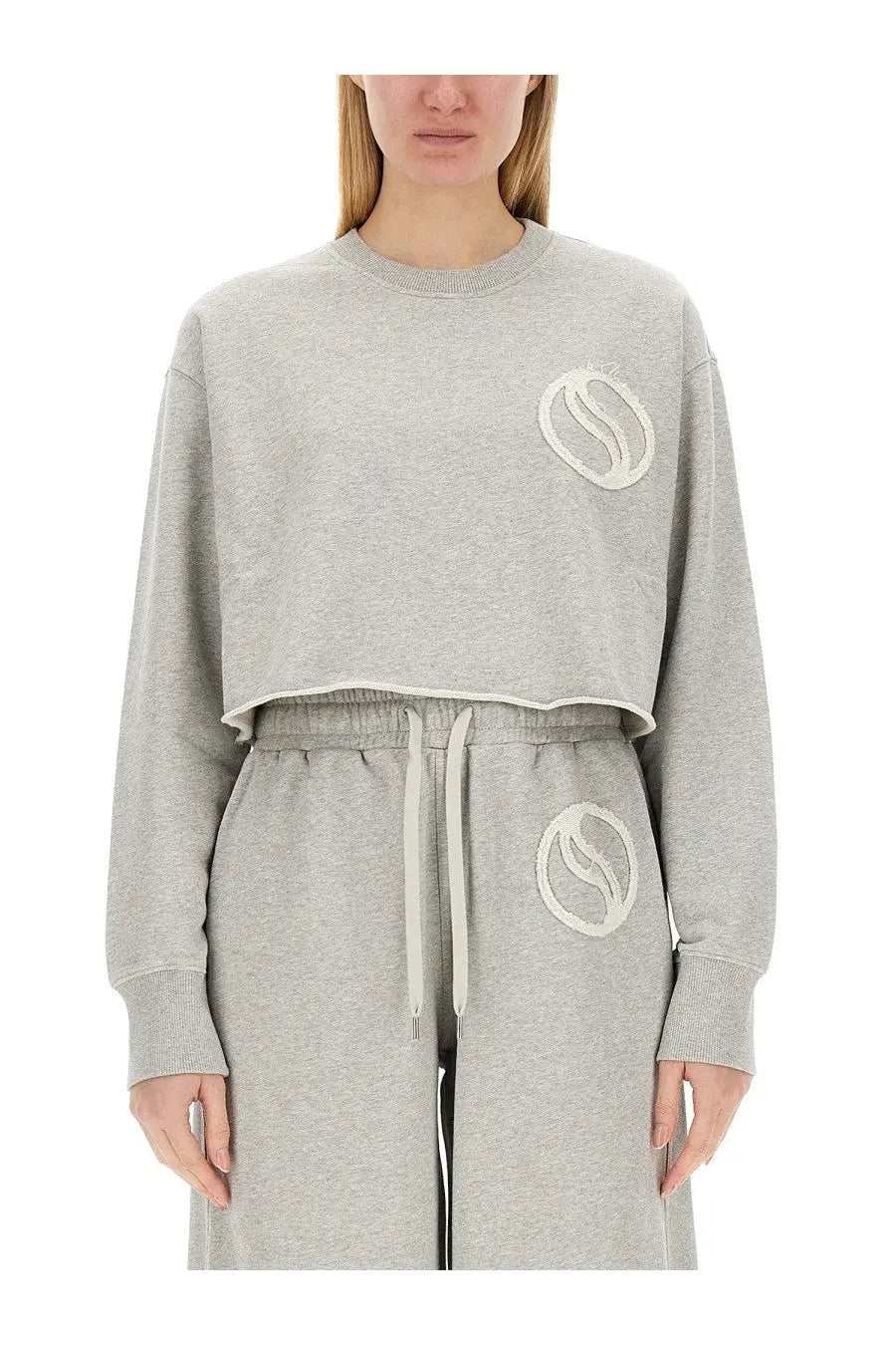Stella McCartney women’s gray cropped sweatshirt with white embroidered coffee bean logo and matching pants set