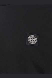 Stone island men’s black cotton shirt featuring a white embroidered compass logo patch on a black stone island jacket