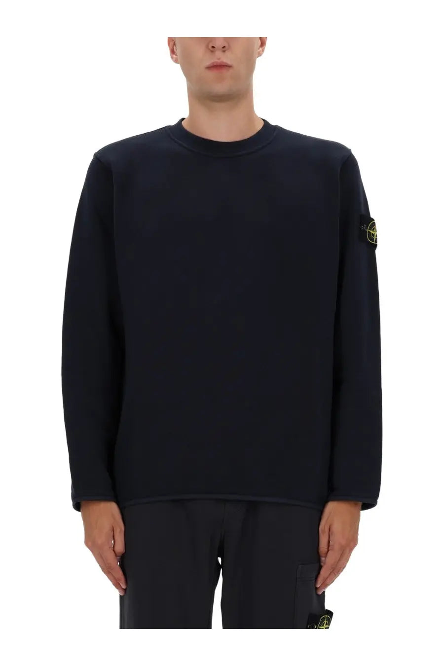 Stone Island men’s black cotton sweatshirt with long sleeves and a subtle yellow logo patch on the left sleeve