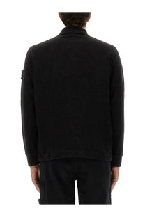 Stone island men’s black cotton vanisé polo shirt with long sleeves collar subtle texture and logo patch on left sleeve