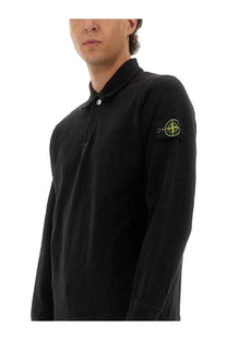 Stone Island men’s black cotton vanisé polo shirt with long sleeves and neon yellow logo patch on the left sleeve