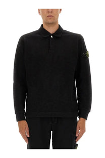 Stone Island men’s black cotton vanisé polo shirt with long sleeves textured fabric and yellow logo patch on left sleeve