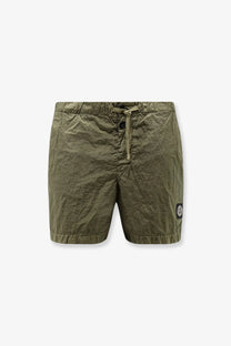 Stone Island men’s olive green Econylon lightweight swim trunks with drawstring waist and logo patch on lower right leg