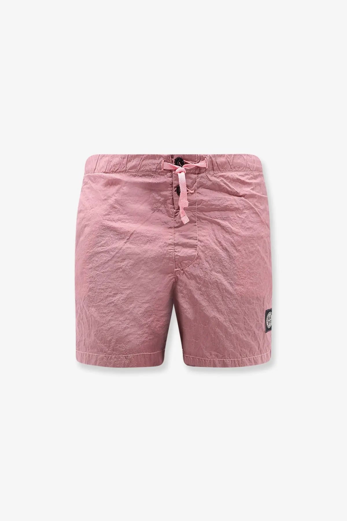Stone island men’s econylon swim trunks in pink featuring textured fabric drawstring waist and black logo patch on side