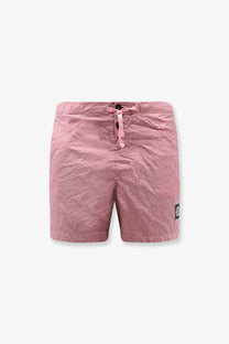 Stone island men’s econylon swim trunks in pink featuring textured fabric drawstring waist and black logo patch on side