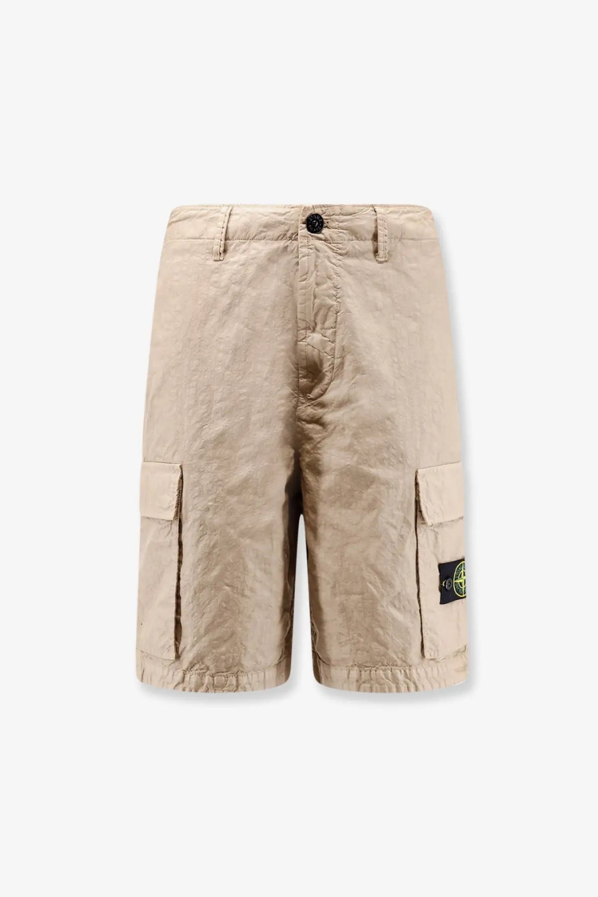 Beige stone island men’s nylon cargo shorts with textured fabric and side pockets featuring logo patch on left leg