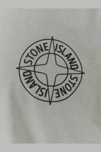 Stone island men’s green organic cotton shirt with black embroidered logo on light gray fabric front view