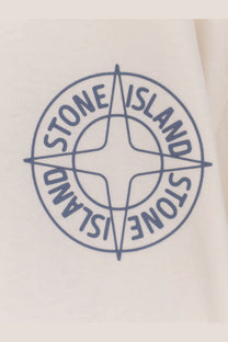 Blue embroidered stone island compass logo on cream-colored fabric of stone island men’s organic cotton white shirt