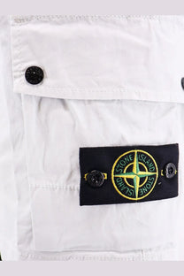 Stone Island men’s organic cotton blue shorts with white stone island cargo pants featuring a black patch with green yellow compass rose logo