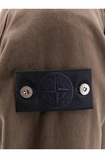 Stone island men’s overshirt cotton jacket umber with black embroidered stone island patch and silver-tone buttons on brown fabric