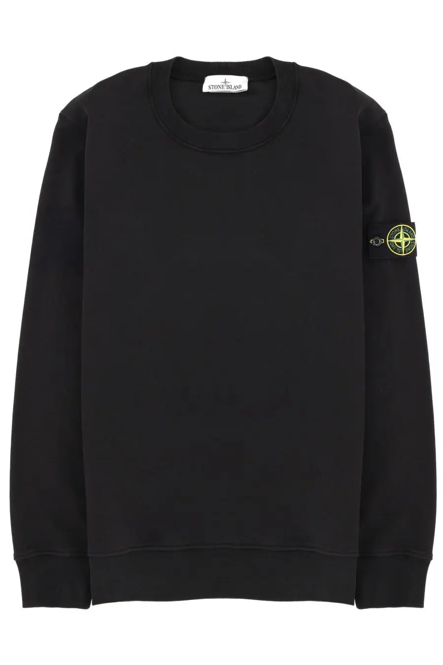 Stone Island men’s black crewneck sweatshirt with neon green compass logo patch on left sleeve and brand tag at neckline