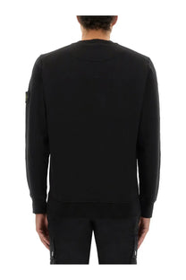 Stone Island men’s regular fit black sweatshirt with ribbed crew neck cuffs and logo patch on left sleeve