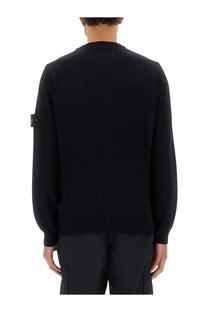 Stone Island men’s black knit sweater with ribbed crew neck and cuffs featuring logo patch on left sleeve