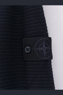 Black ribbed knit Stone Island men’s sweater with wool cashmere blend and matching black patch featuring compass logo