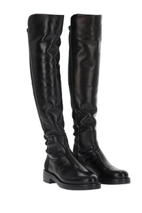 Stuart Weitzman women’s Celia black leather over-the-knee boots with glossy finish and low block heel side view