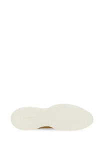 Cream-colored rubber sole with textured raised profile and subtle branding near the heel of stuart weitzman beige sneaker