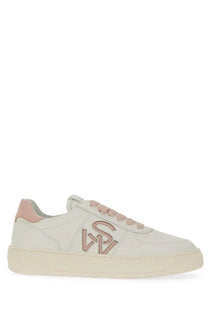 Stuart Weitzman women’s cream leather sneaker with pink laces and matching pink logo on the side