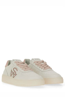 Stuart Weitzman women’s off white suede sneakers with pink laces and matching logo on the side