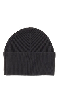 Studio nicholson men’s mikkel hat blue is a black ribbed knit beanie with a folded cuff made from soft material