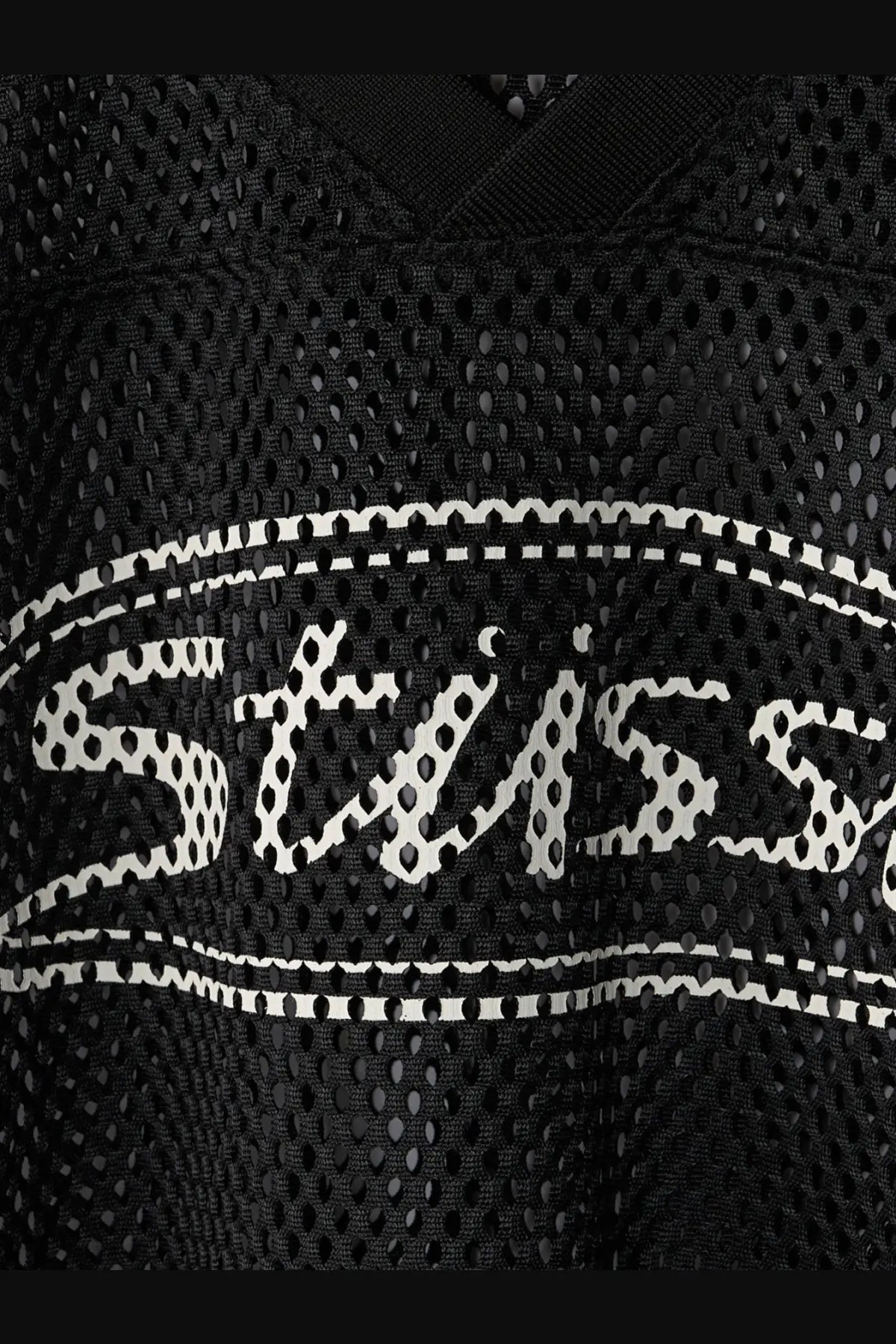 Stussy men’s black perforated nylon athletic jersey featuring a white stussy logo with dotted outline and stitched border