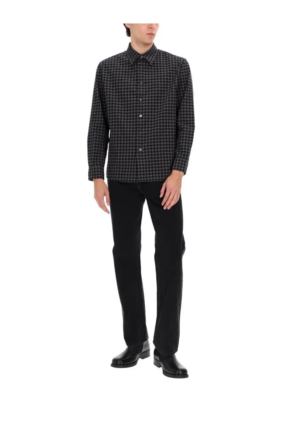 Black and gray checkered long-sleeve button-down shirt paired with sunflower men’s wide twist jeans black
