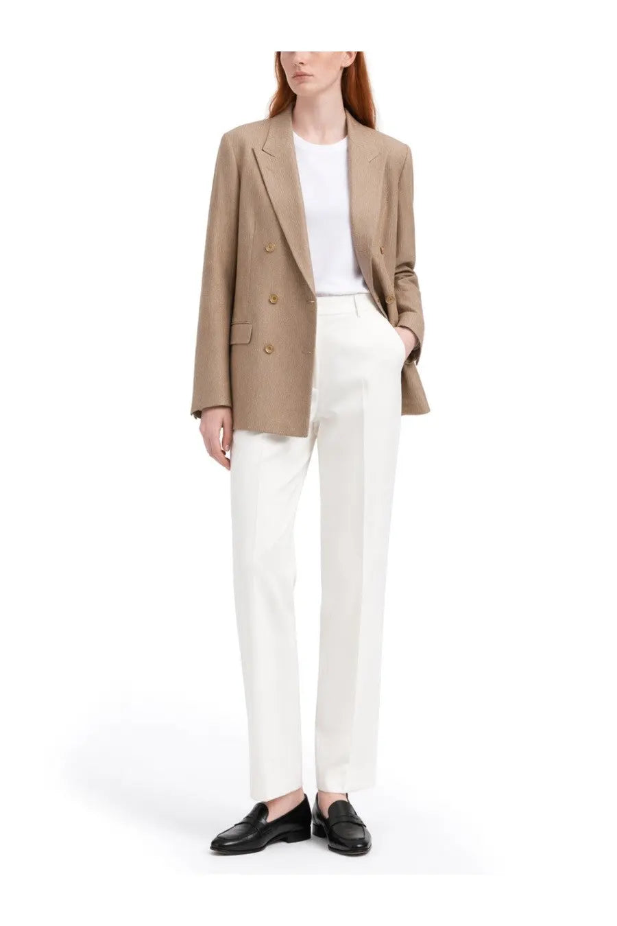 A tailored camel-colored double-breasted blazer with gold buttons and structured shoulders by tagliatore