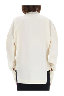 Cream-colored oversized blouse with relaxed fit and long sleeves from Thelatest women’s shirt Cecilia Yellow collection