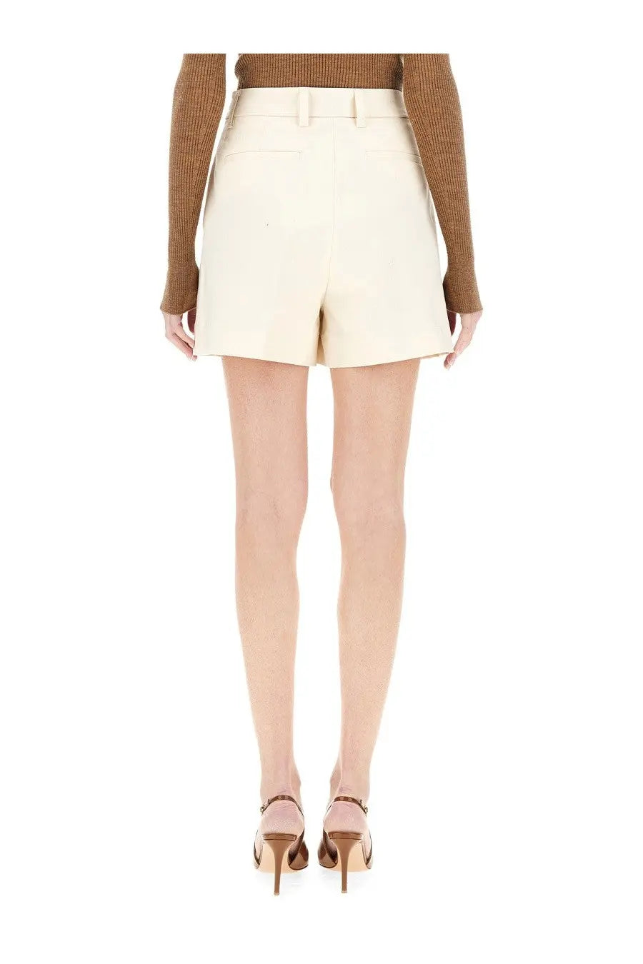 Thelatest women’s shorts bea white cream-colored high-waisted tailored shorts with a clean structured design