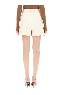 Thelatest women’s shorts bea white cream-colored high-waisted tailored shorts with a clean structured design