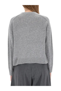 Theory women’s cashmere sweater grey is a soft heather gray knit with ribbed cuffs and hem for cozy wear