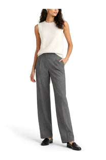 Theory women’s cashmere top white paired with gray wide-leg tailored trousers with subtle front pleats