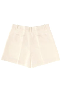 Theory women’s fluid white tailored shorts shown from the back with a cream color and subtle pleats