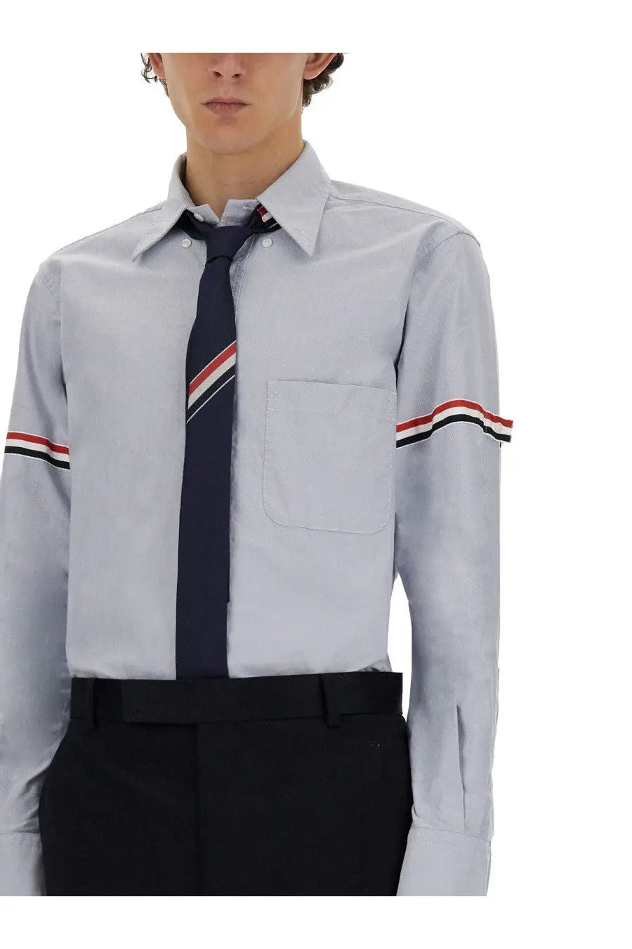 Thom Browne men’s classic light gray long-sleeved dress shirt with red white and black striped cuffs and collar