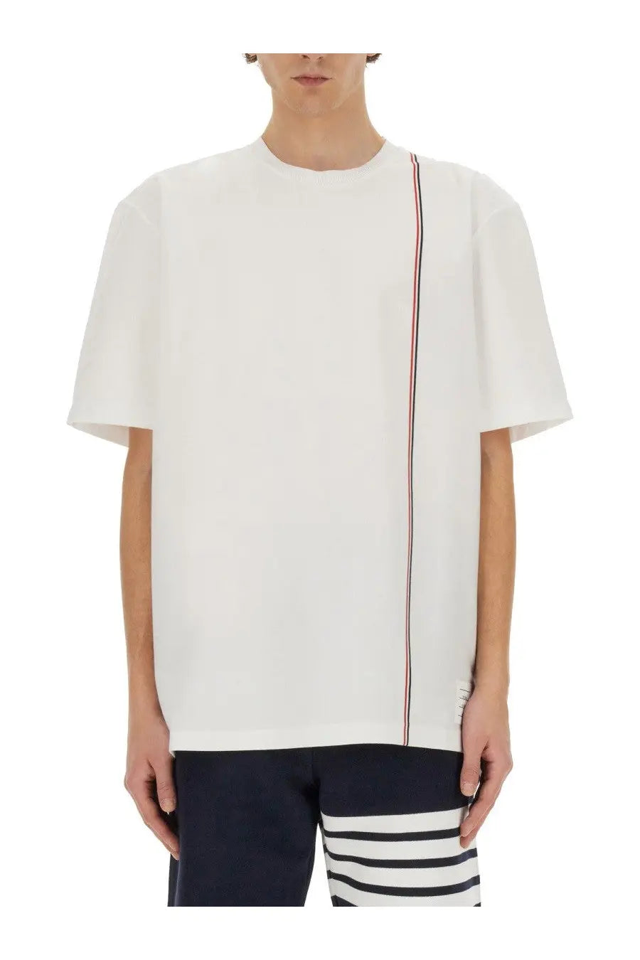 Thom Browne men’s white jersey shirt with short sleeves and a vertical red white and blue stripe down the side
