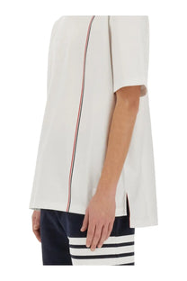 Thom browne men’s white jersey shirt with short sleeves and red white navy vertical stripe detail on side seam