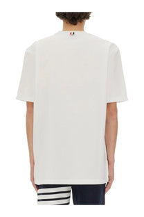 Thom Browne men’s white jersey t-shirt with a subtle red white and blue logo at the neckline