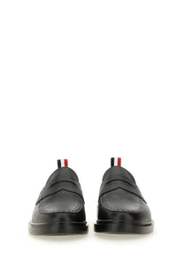 Thom Browne men’s moccasin penny black leather loafers with classic broguing and red white black striped pull tabs