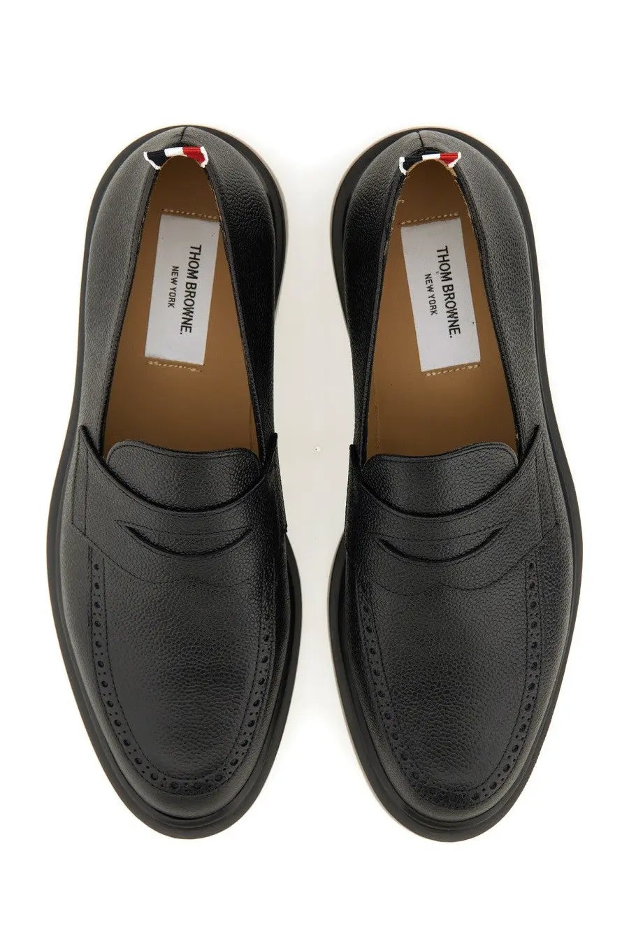 Thom Browne men’s moccasin penny black leather loafers with textured surface and classic brogue detailing