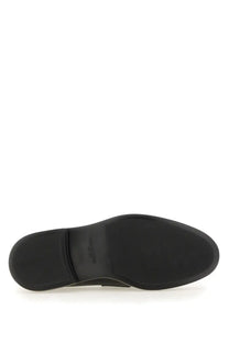 Thom browne men’s moccasin penny black black rubber sole with textured grip pattern and embossed brand logo near heel