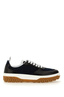 Thom Browne men’s trainer letterman blue black and white low-top sneaker with patent leather toe cap suede upper and gum sole