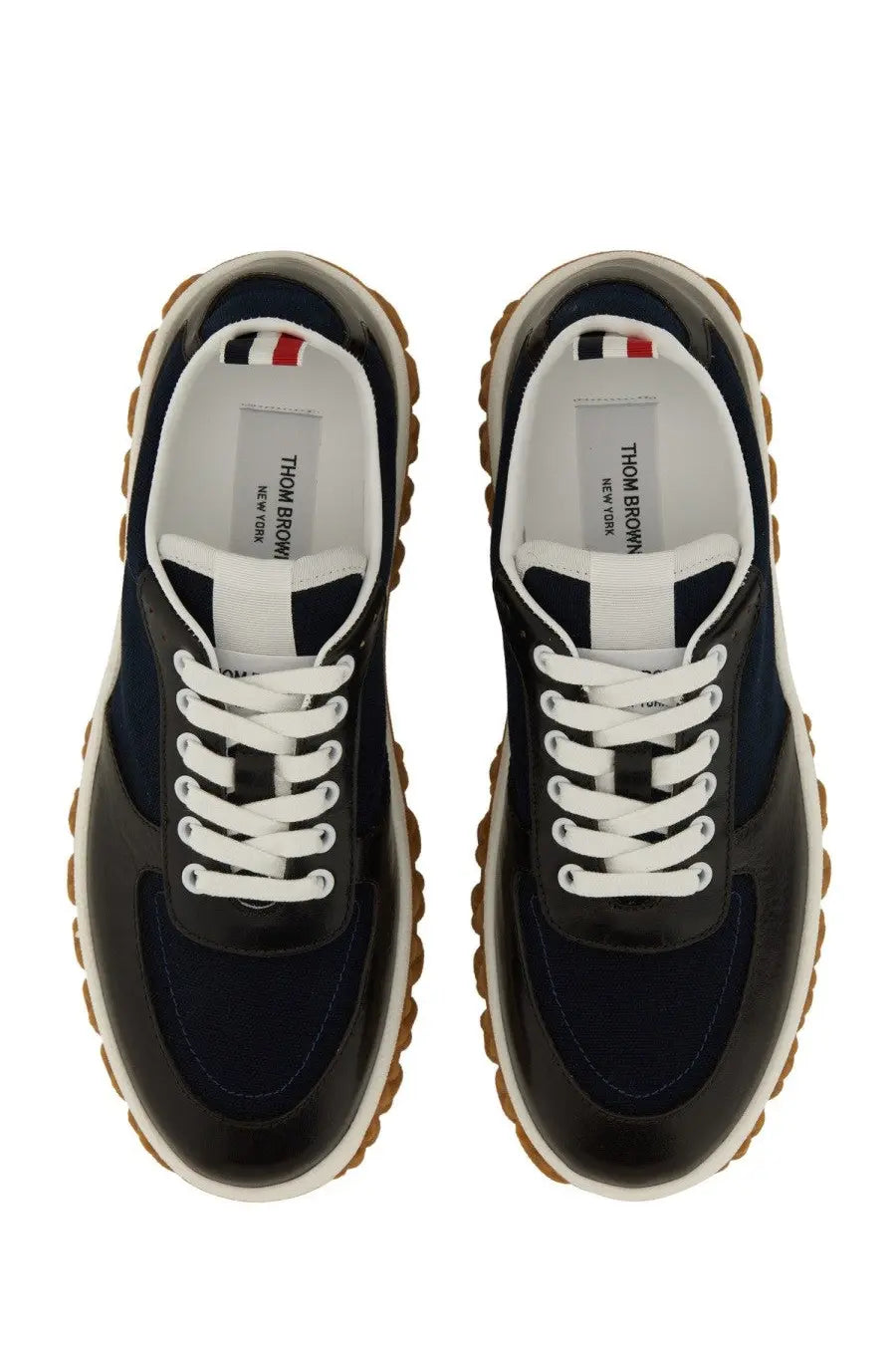 Thom Browne men’s trainer letterman blue sneakers in navy blue and black with white laces and textured rubber sole