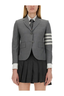 Thom Browne women’s grey single breasted blazer with three white sleeve stripes and button closure