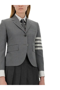 Thom Browne women’s single breasted grey tweed blazer with three horizontal white stripes on sleeve and matching cuffs