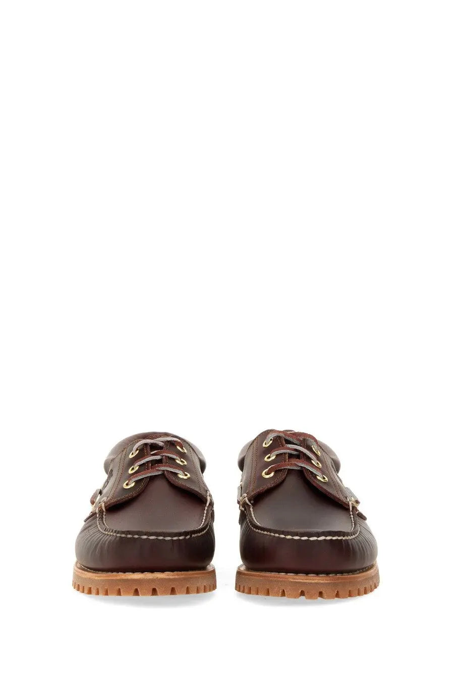 Timberland men’s authentic boat moccasin in brown leather with tan rubber soles and gold-tone eyelets
