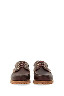 Timberland men’s authentic boat moccasin in brown leather with tan rubber soles and gold-tone eyelets
