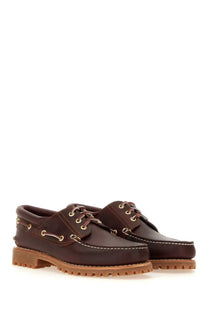 Timberland men’s authentic boat moccasin brown leather boat shoes with tan rubber soles and gold-tone eyelets