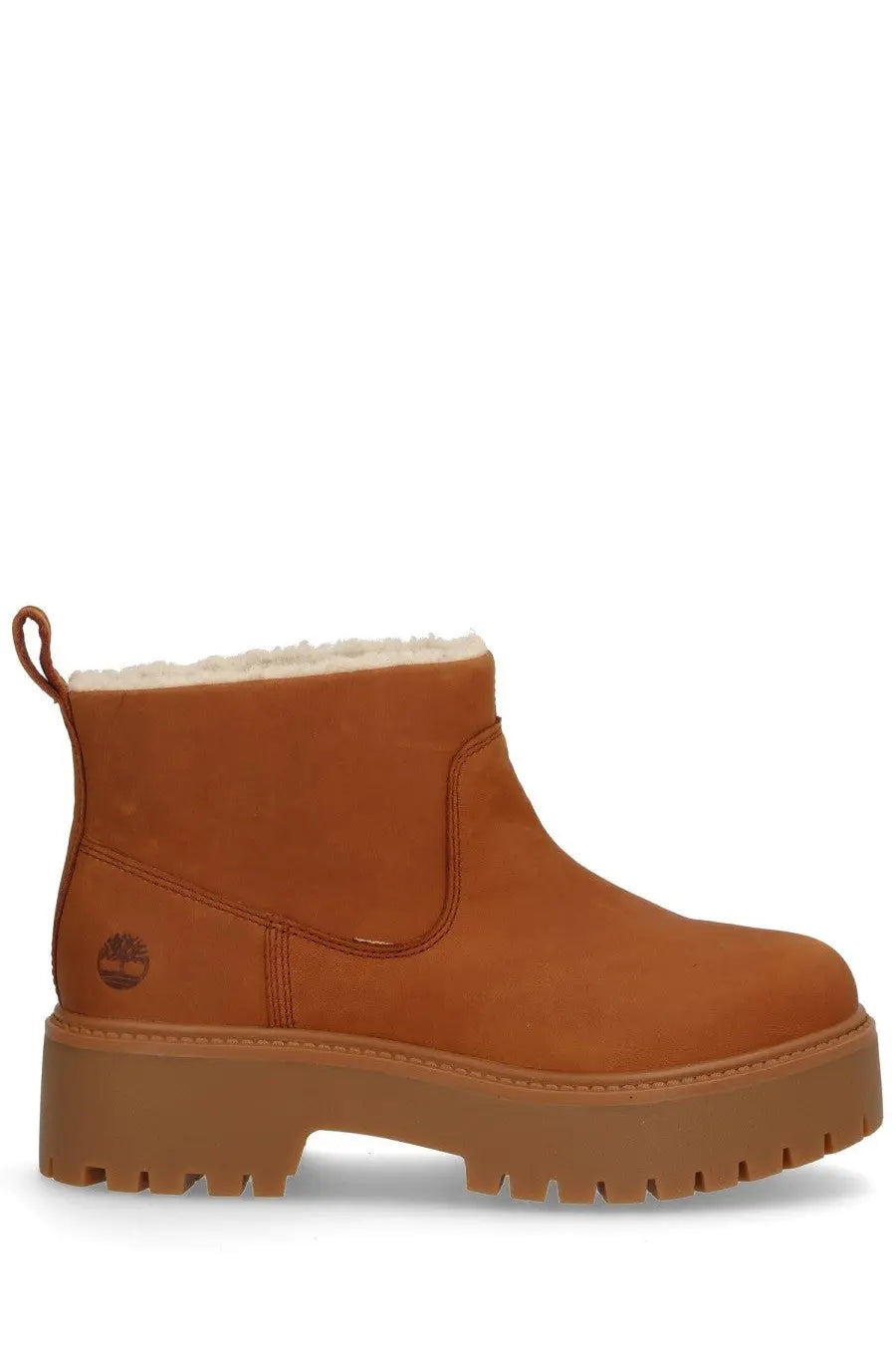 Timberland women’s leather boot in brown with tan timberland boot design, plush white shearling lining, and chunky rubber sole